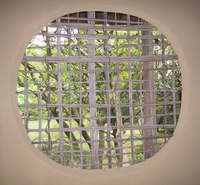 Window of the Joan tea house in the Urakuen tea garden in Inuyama, used for tea ceremonies. The Joan tea house was built in 1618 by Oda Uraku 1547-1621, younger brother of Oda Nobunaga. Tea master Oda Uraku was a student of the famous tea master Sen no Rikyu. While the Joan tea house was originally built in Kyoto, it was moved to its current location in 1972. The building is considered one of the finest examples of tea house architecture. The window is woven bamboo tied together with a climbing plant, on an adobe wall
TeaHouseWindowInuYama.jpg